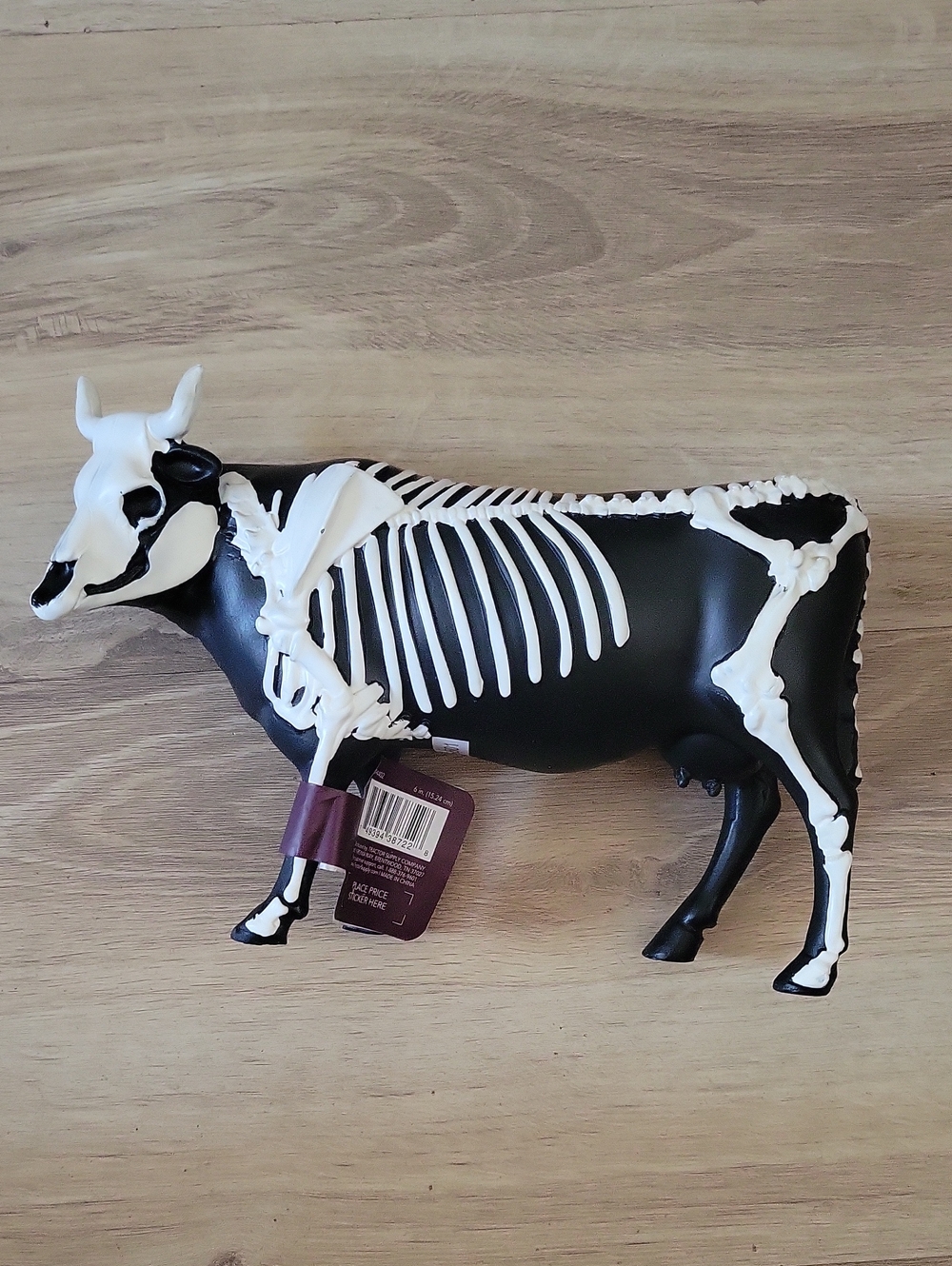 Black Cow Figurine with White Skeleton Design